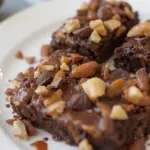 Chocolate Brownies With Nuts And Sauce