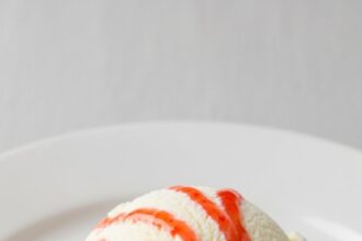 Vanilla Ice Cream With Strawberry Syrup