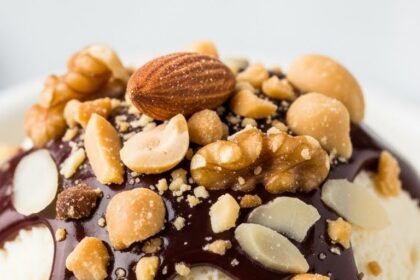 Ice Cream With Nuts And Chocolate Sauce
