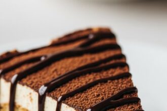 Slice Of Tiramisu With Chocolate Drizzle