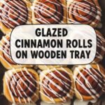 Glazed Cinnamon Rolls On Wooden Tray