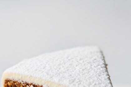 Slice Of Moist Cake With Powdered Sugar